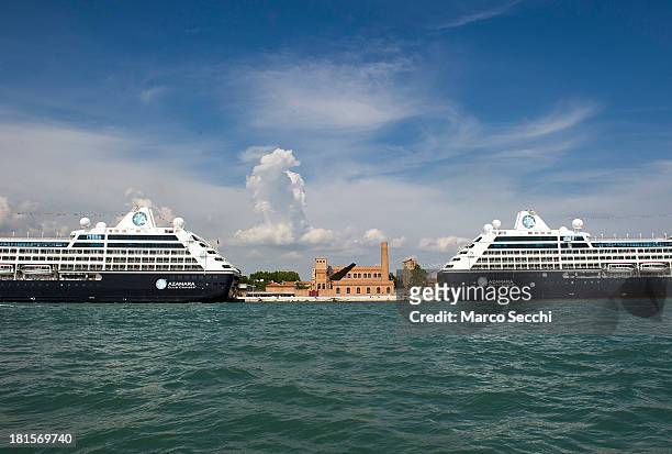 Two nearly identical cruise ships are moored on the day when Venice saw a record number of cruise ships entering the Port on September 21, 2013 in...