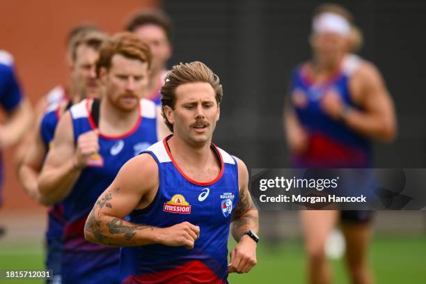 Caleb Daniel of the Bulldogs competes in the 2km time trial during a Western Bulldogs AFL training session at Whitten Oval on November 27, 2023 in...