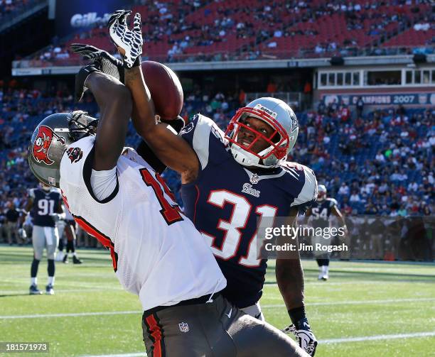 Aqib Talib of the New England Patriots breaks up a pass intended for Mike Williams of the Tampa Bay Buccaneers during the 4th quarter in a game at...