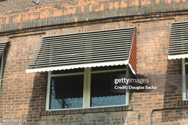old style window awnings - sonnensegel stock-fotos und bilder