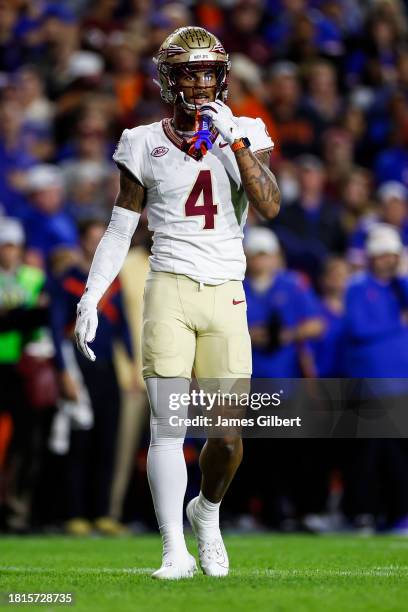 Keon Coleman of the Florida State Seminoles looks on during the first half of a game against the Florida Gators at Ben Hill Griffin Stadium on...