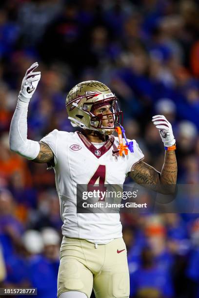Keon Coleman of the Florida State Seminoles looks on during the first half of a game against the Florida Gators at Ben Hill Griffin Stadium on...