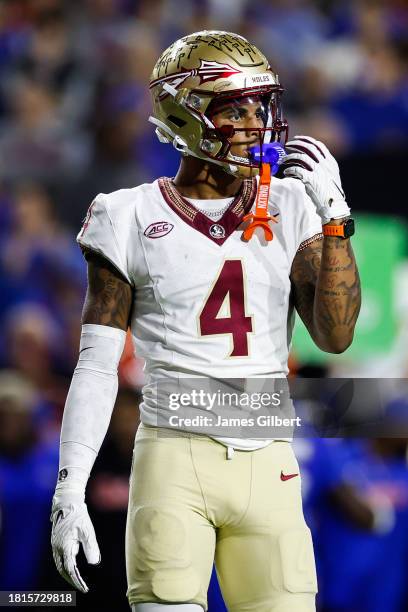 Keon Coleman of the Florida State Seminoles looks on during the first half of a game against the Florida Gators at Ben Hill Griffin Stadium on...