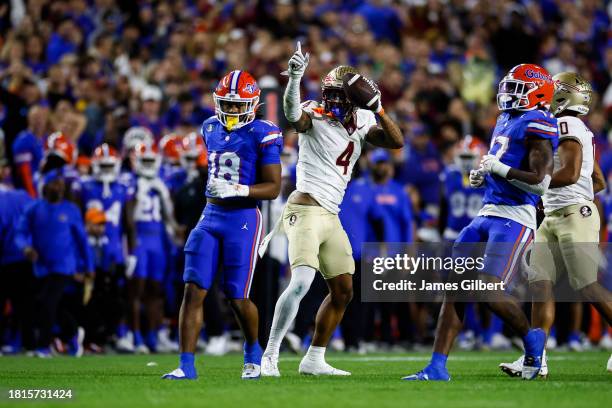 Keon Coleman of the Florida State Seminoles celebrates a first down after making a catch during the second half of a game against the Florida Gators...