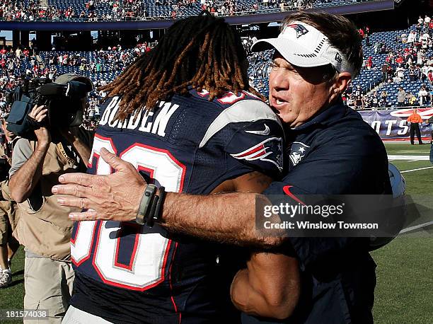 Head coach Bill Belichick of the New England Patriots hugs Brandon Bolden of the New England Patriots after their 23-3 win over the Tampa Bay...