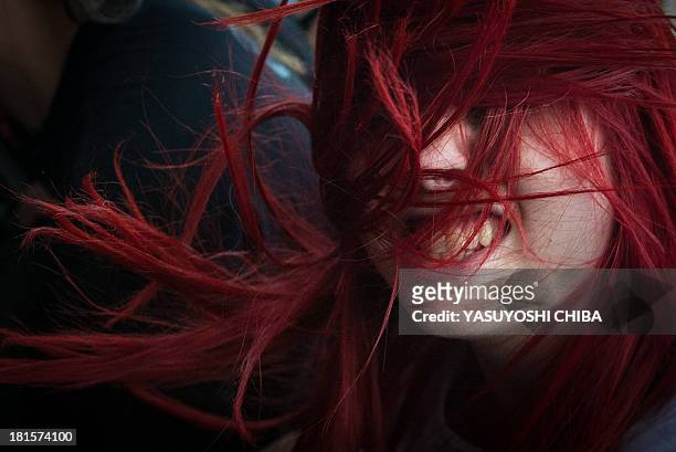 Woman attends the final day of Rock in Rio music festival in Rio de Janeiro, Brazil, on September 22, 2013. Rock in Rio announced there will also be...