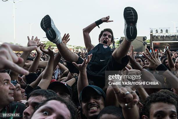 Man is held up by the audience during Rock in Rio music festival in Rio de Janeiro, Brazil, on September 22, 2013. Rock in Rio announced there will...