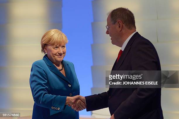 German Chancellor and candidate for the Christian Democratic Union Angela Merkel shakes hands with Social Democratic party candidate Peer Steinbrueck...