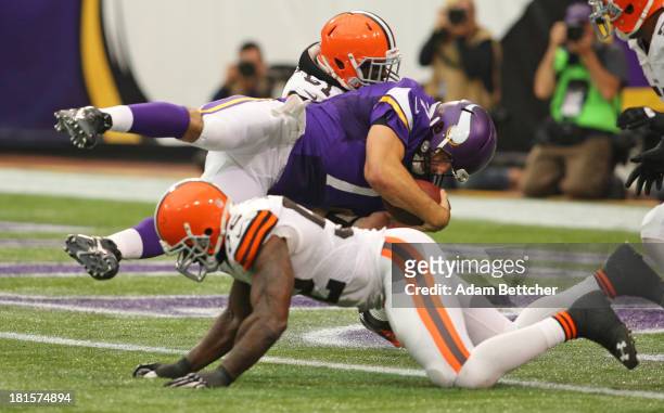 Christian Ponder of the Minnesota Vikings dives into the end zone for a touchdown against the Cleveland Browns on September 22, 2013 at Mall of...