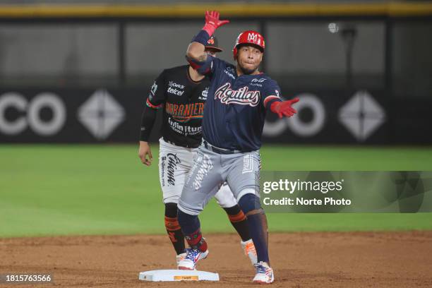 Yangervis Solarte of Aguilas de Mexicali celebrates a double off second base Jason Atondo of Naranjeros in the third inning, during a game between...