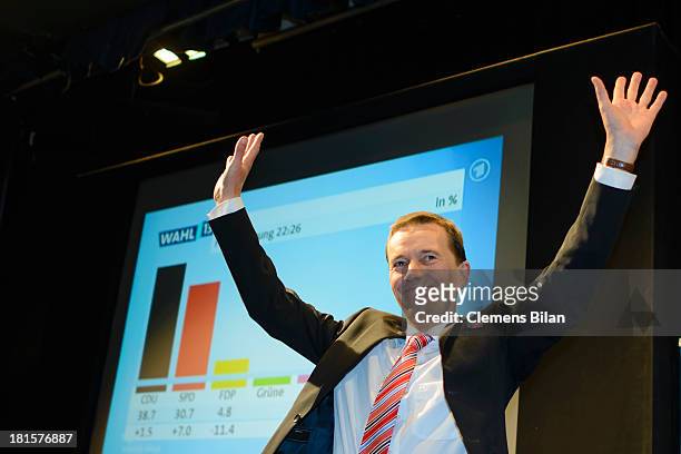 Bernd Lucke, head of the Euro-skeptic political party Alternative fuer Deutschland , greets his supporters during German federal elections at...