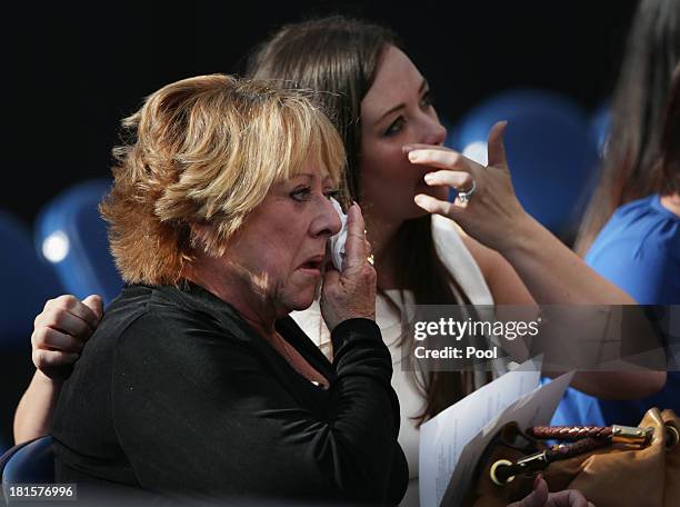 Woman gets emotional at a memorial for the victims of the Washington Navy Yard shooting September 22, 2013 at the Marine Barracks in Washington, D.C....