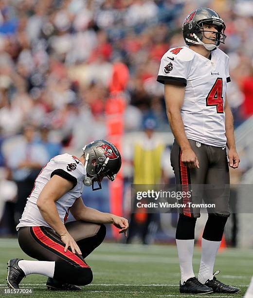 Place kicker Rian Lindell of the Tampa Bay Buccaneers and holder Dan Orlovsky of the Tampa Bay Buccaneers react to a missed field goal during the...