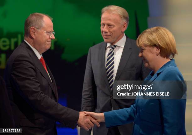 German Chancellor and candidate for the Christian Democratic Union Angela Merkel shakes hands with Social Democratic party candidate Peer Steinbrueck...