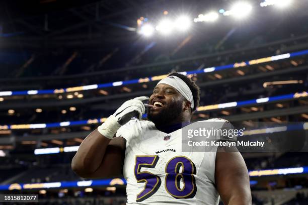 Michael Pierce of the Baltimore Ravens celebrates after defeating the Los Angeles Chargers in the game at SoFi Stadium on November 26, 2023 in...