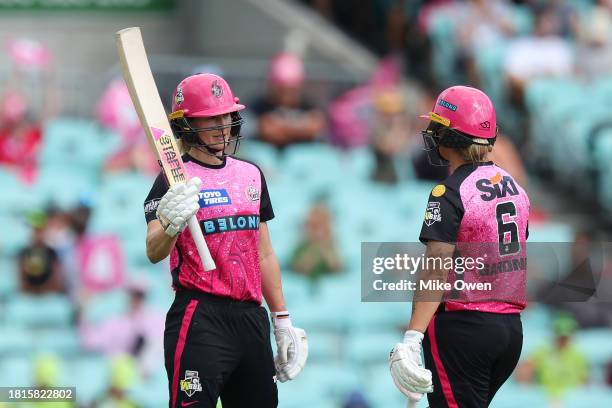 Ellyse Perry of the Sixers celebrates after scoring a half century during the WBBL match between Sydney Sixers and Sydney Thunder at Sydney Cricket...