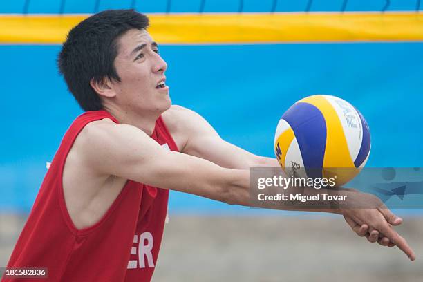 Alexander Vazques of Peru digs the ball during the Men's Beach Volleyball Qualification as part of the I ODESUR South American Youth Games at Parque...