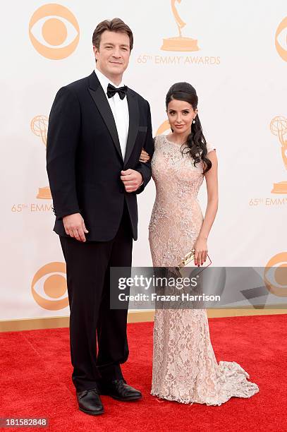 Actor Nathan Fillion and actress Mikaela Hoover arrive at the 65th Annual Primetime Emmy Awards held at Nokia Theatre L.A. Live on September 22, 2013...