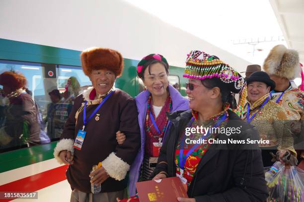 Passengers prepare to board the first train from Shangri-La to Lijiang on November 26, 2023 in Shangri-La, Diqing Tibetan Autonomous Prefecture,...