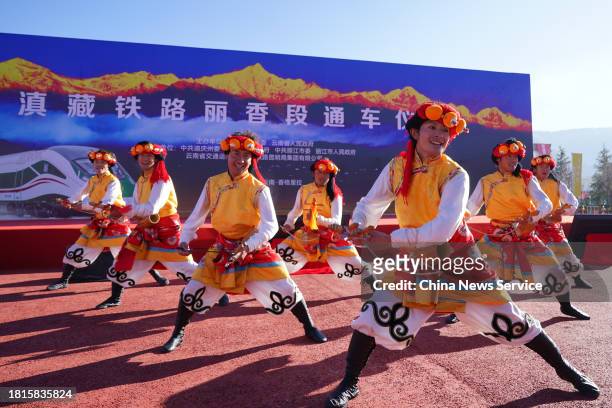 People dance at the ceremony marking the opening of the Lijiang-Shangri-la railway at the Shangri-la railway station on November 26, 2023 in...