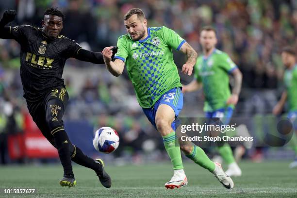 Los Angeles FC defender Jesús Murillo and Seattle Sounders forward Jordan Morris battle for the ball during the second half at Lumen Field on...