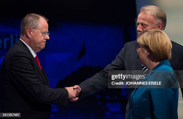 German Chancellor and candidate for the Christian Democratic Union Angela Merkel looks on as the Social Democratic party's candidate Peer Steinbrueck...