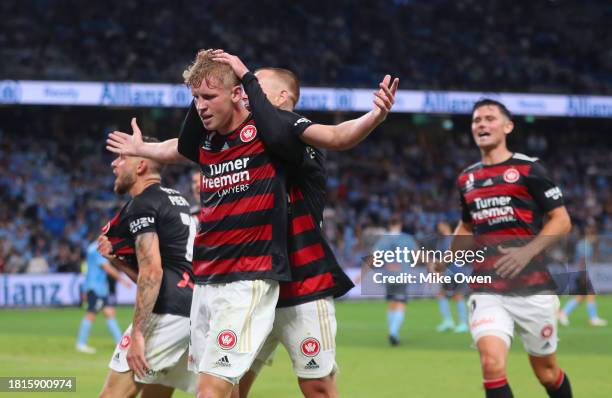 Zac Sapsford of the Wanderers celebrates with teammates after scoring the teams first goal during the A-League Men round five match between Sydney FC...
