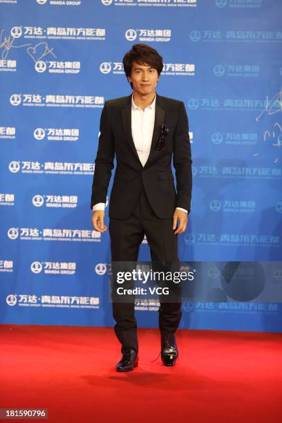 Actor Jerry Yan arrives on the red carpet during the opening night of the Qingdao Oriental Movie Metropolis at Qingdao Beer City on September 22,...