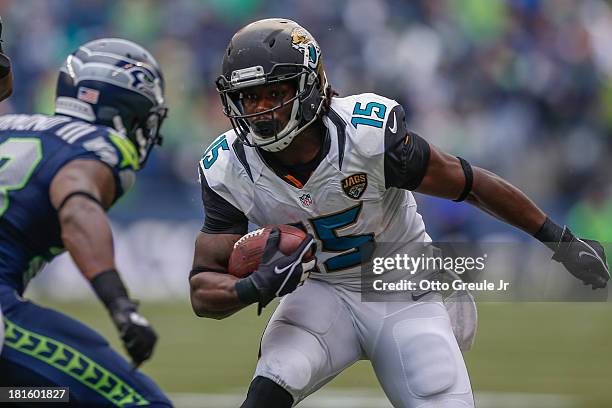 Wide receiver Stephen Burton of the Jacksonville Jaguars rushes against cornerback Walter Thurmond of the Seattle Seahawks at CenturyLink Field on...