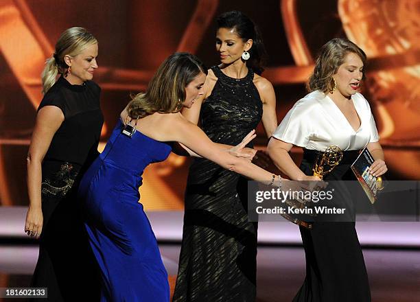 Actress/writers Amy Poehler and Tina Fey, and Winner for Supporting Actress in a Comedy Series Merritt Wever speak onstage during the 65th Annual...