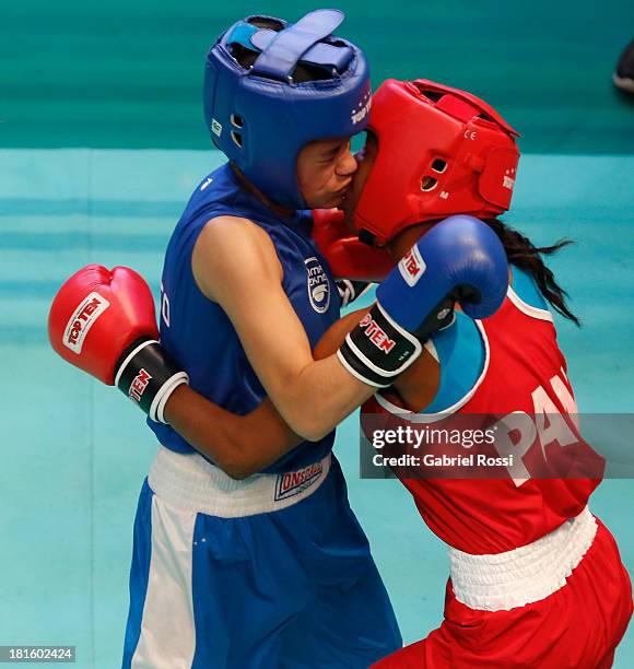 Ayelen Espinosa of Argentina competes with Naneth Carrion of Panama during the Women's 48kg Boxing Qualifications as part of the I ODESUR South...