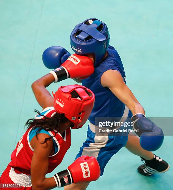 Ayelen Espinosa of Argentina competes with Naneth Carrion of Panama during the Women's 48kg Boxing Qualifications as part of the I ODESUR South...