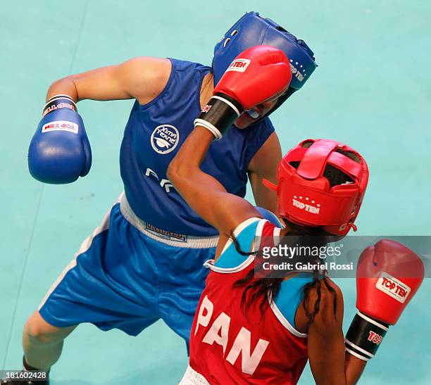 Ayelen Espinosa of Argentina competes with Naneth Carrion of Panama during the Women's 48kg Boxing Qualifications as part of the I ODESUR South...