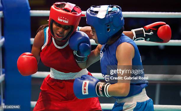 Ayelen Espinosa of Argentina competes with Naneth Carrion of Panama during the Women's 48kg Boxing Qualifications as part of the I ODESUR South...