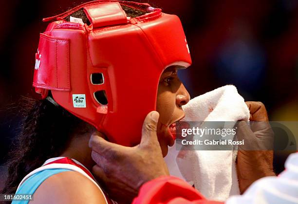 Naneth Carrion of Panama takes off her boxing mouthguard during the Women's 48kg Boxing Qualifications as part of the I ODESUR South American Youth...