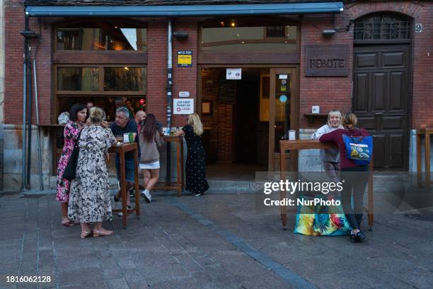 People are enjoying themselves at ''El Rebote,'' one of the most famous spots in the ''Barrio Humedo'' in the old town of Leon, Spain, an area known...