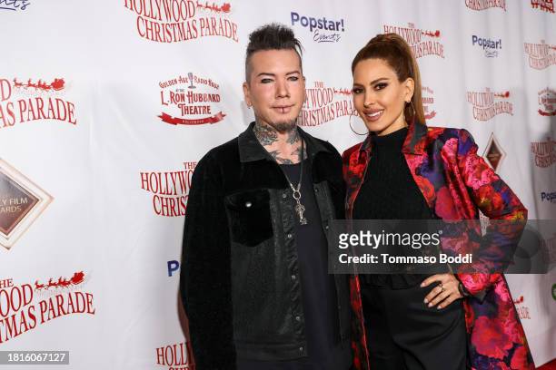 Ashba and Kerri Kasem attend the 91st anniversary of the Hollywood Christmas Parade, supporting Marine Toys For Tots on November 26, 2023 in...