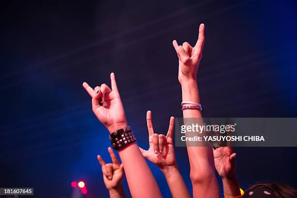 Fans attend the performance of Brazilian band Kiara Rocks during the final day of the Rock in Rio music festival in Rio de Janeiro, Brazil, on...