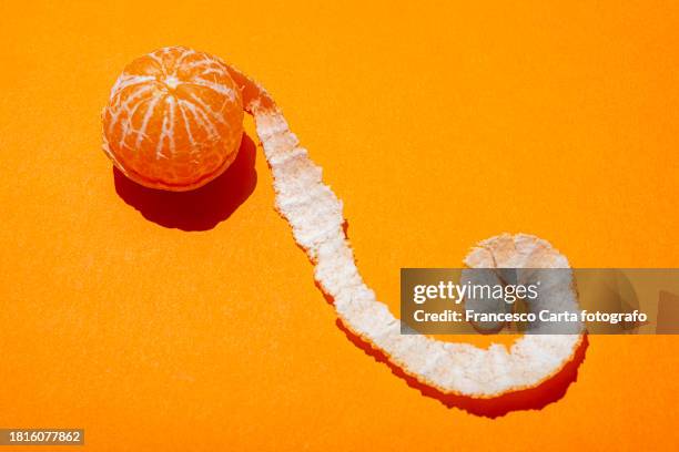 peeled mandarin - mandarine stock-fotos und bilder