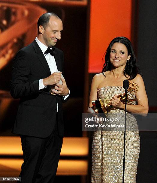 Winner of Best Supporting Actor in a Comedy Series Tony Hale and winner of Best Lead Actress in a Comedy Series, Julia Louis-Dreyfus speak onstage...