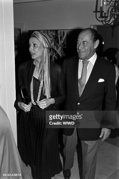 Mercia Tinker and Rex Harrison attend a party in the Brentwood neighborhood of Los Angeles, California, on January 17, 1978.