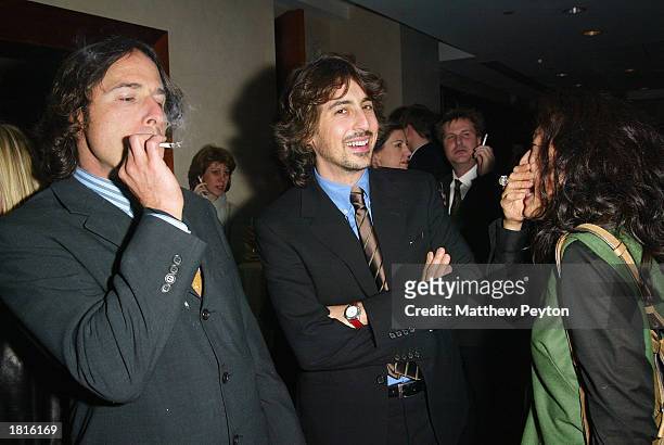 Director David O. Russell enjoys a smoke with director Alexander Payne and wife Sandra Oh at the after party for the MOMA Celebration of the Films of...