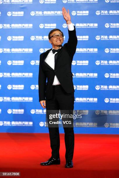 Actor Christoph Waltz arrives on the red carpet during the opening night of the Qingdao Oriental Movie Metropolis at Qingdao Beer City on September...