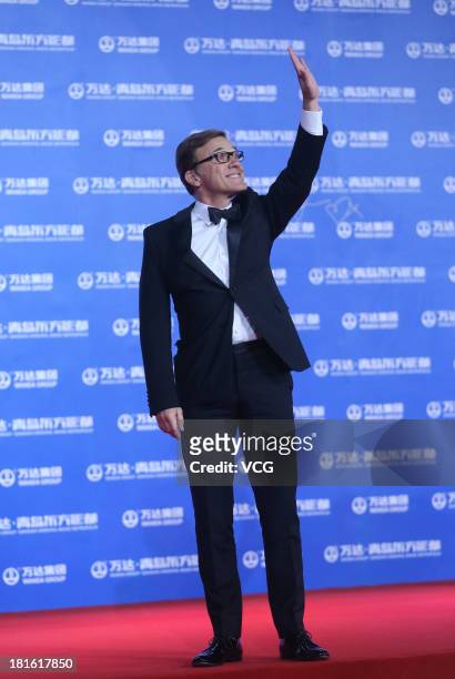 Actor Christoph Waltz arrives on the red carpet during the opening night of the Qingdao Oriental Movie Metropolis at Qingdao Beer City on September...