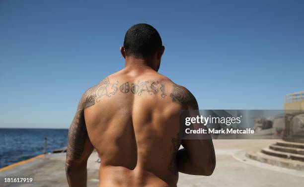Roy Asotasi walks to the ocean during a South Sydney Rabbitohs NRL recovery session at Clovelly Beach on September 23, 2013 in Sydney, Australia.