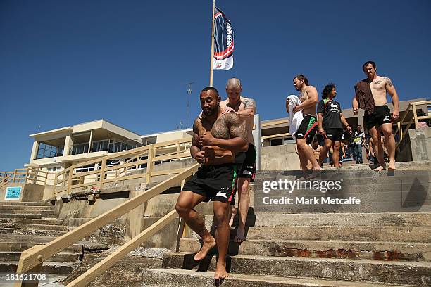 Roy Asotasi and team mates walk to the ocean during a Sydney Rabbitohs NRL recovery session at Clovelly Beach on September 23, 2013 in Sydney,...