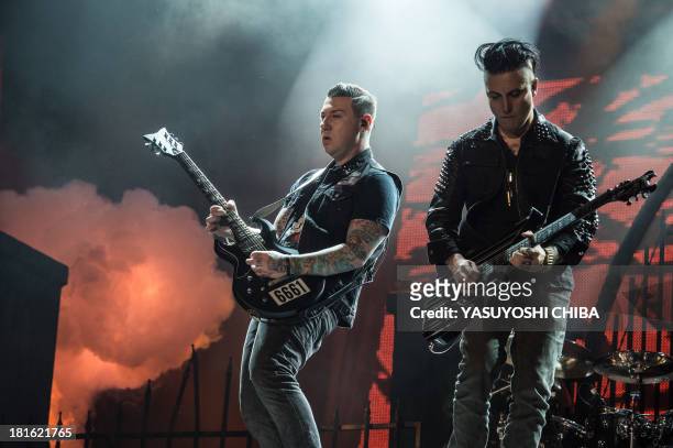 Zacky Vengeance and Synyster Gates of American heavy metal band Avenged Sevenfold perform during the final day of the Rock in Rio music festival in...