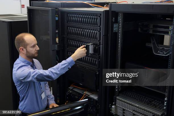 changing drive in server installation in large datacenter - computer memory stock pictures, royalty-free photos & images
