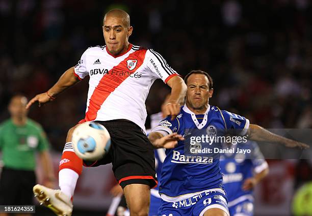 Jonatan Maidana, of River Plate, and Mauro Matos, of All Boys, fight for the ball during a match between River Plate and All Boys as part of the...