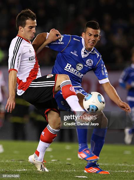 Federico Andrada, of River Plate, and Nehuen Paz, of All Boys, fight for the ball during a match between River Plate and All Boys as part of the...